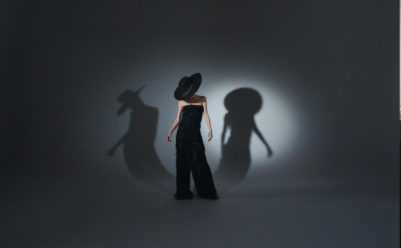 Jumpsuit, Maison Rabih Kairouz; shoes, Christian Louboutin; hat, Maison Michel; earrings, Domestique.