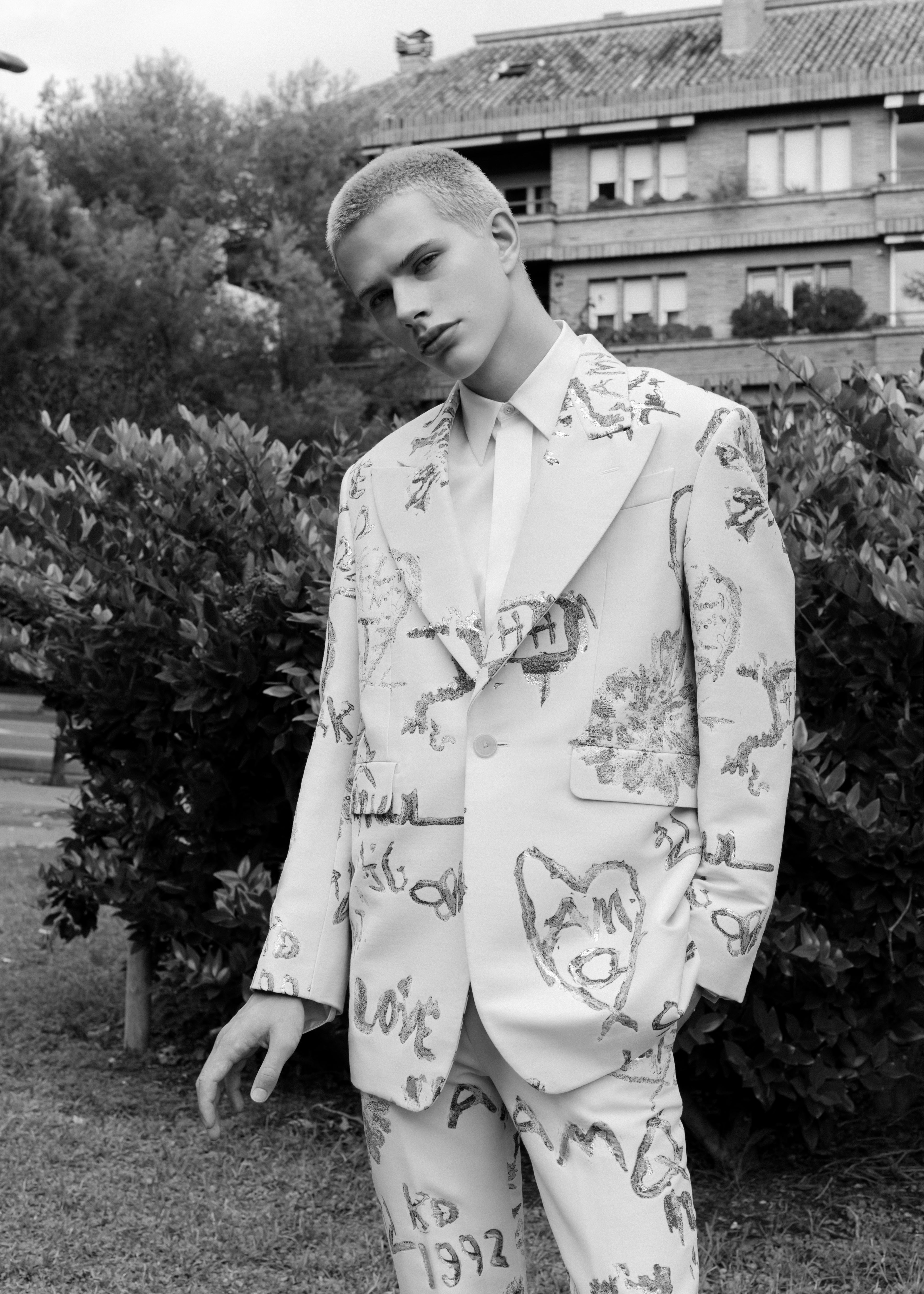 Shirt, jacket, pants, all Alexander McQueen. Shirt, jacket, pants, all Alexander McQueen.