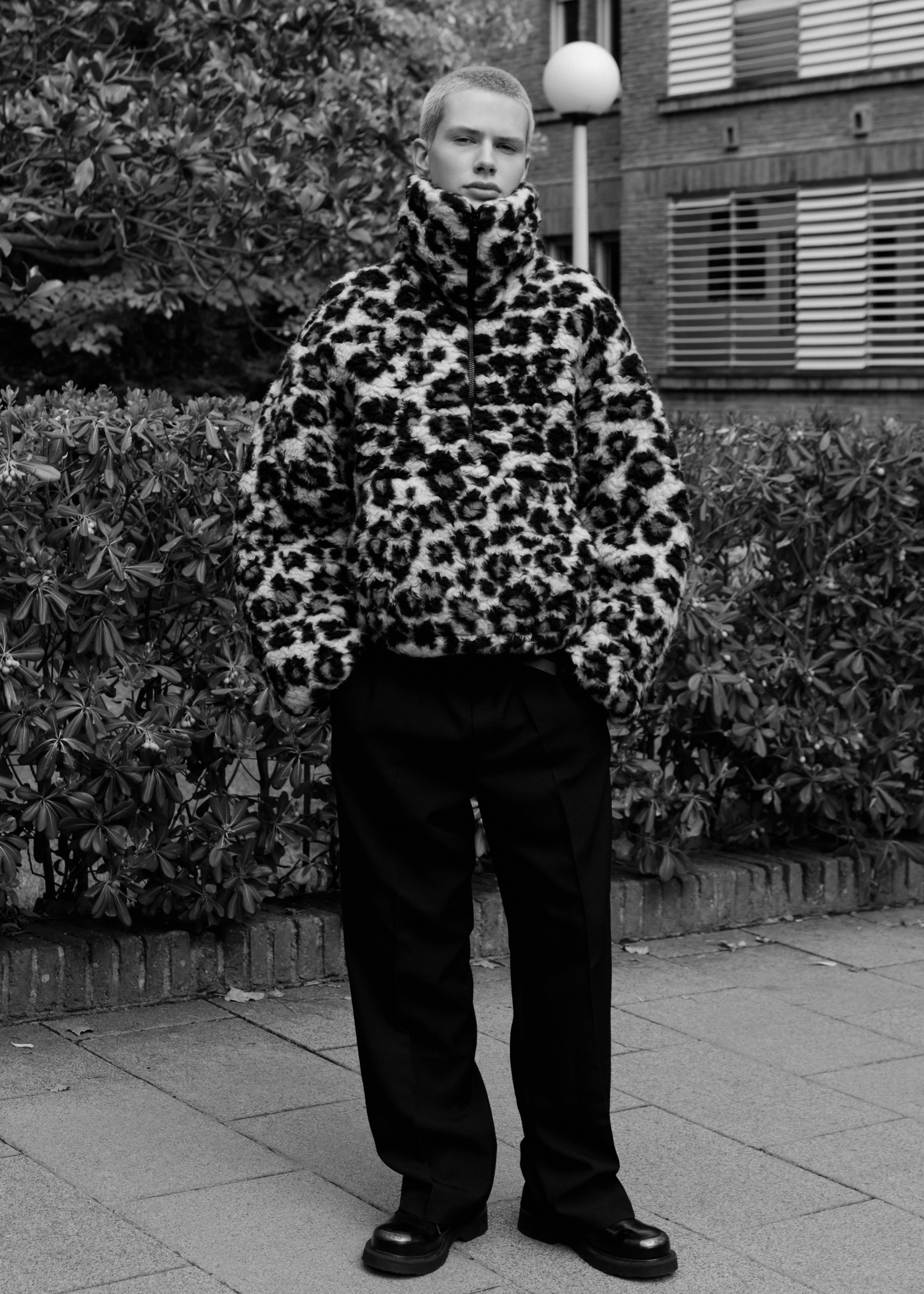 Jacket, Versace, pants, Louis Vuitton; shoes, Kenzo.