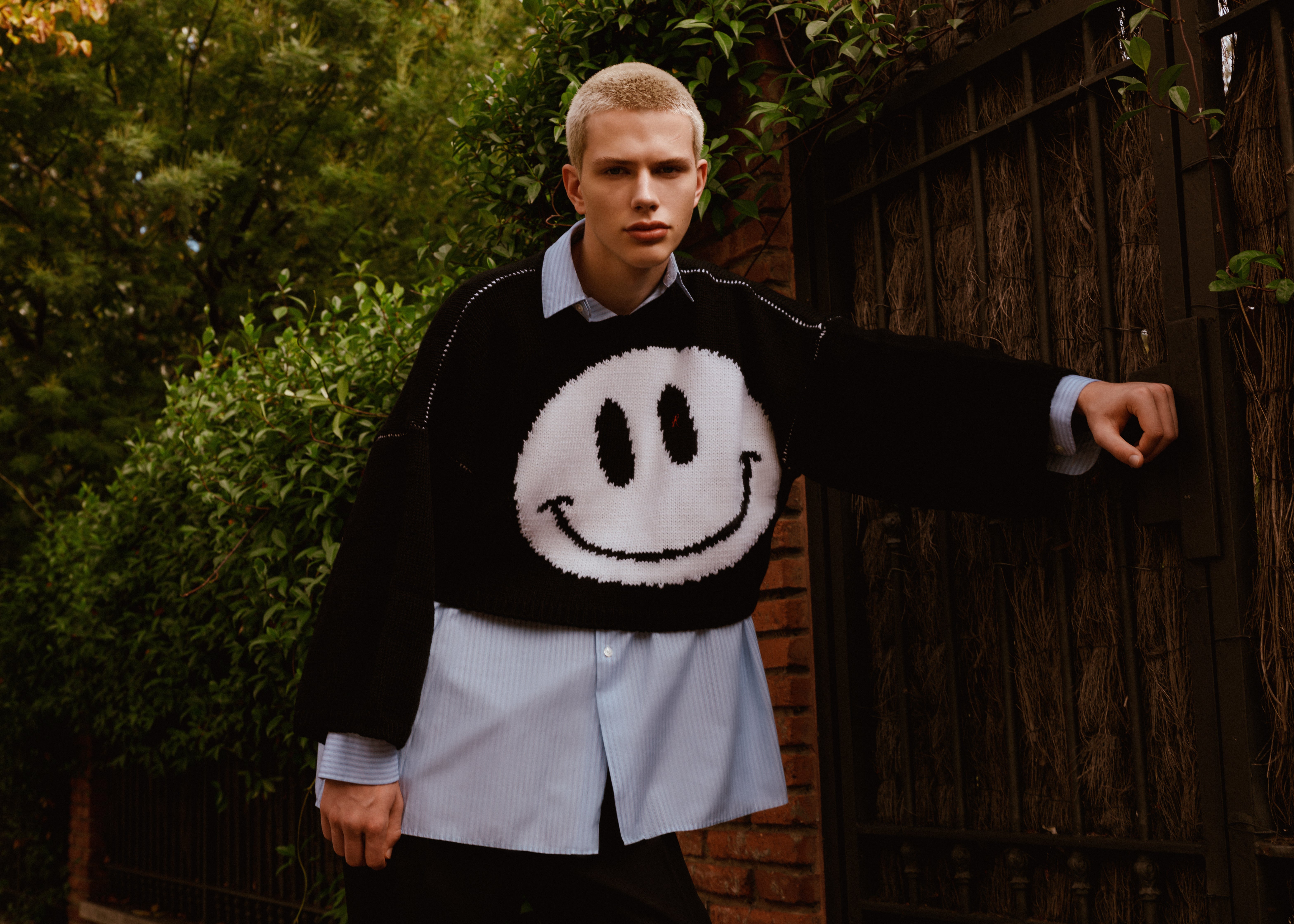 Sweater, Raf Simons; shirt, Christian Dior; pants, Louis Vuitton. Sweater, Raf Simons; shirt, Christian Dior; pants, Louis Vuitton.